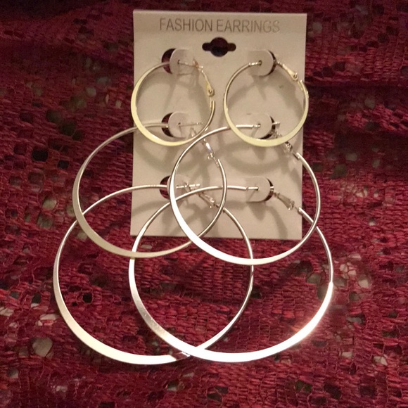 Jewelry - Three pair of silver plated large hoops.